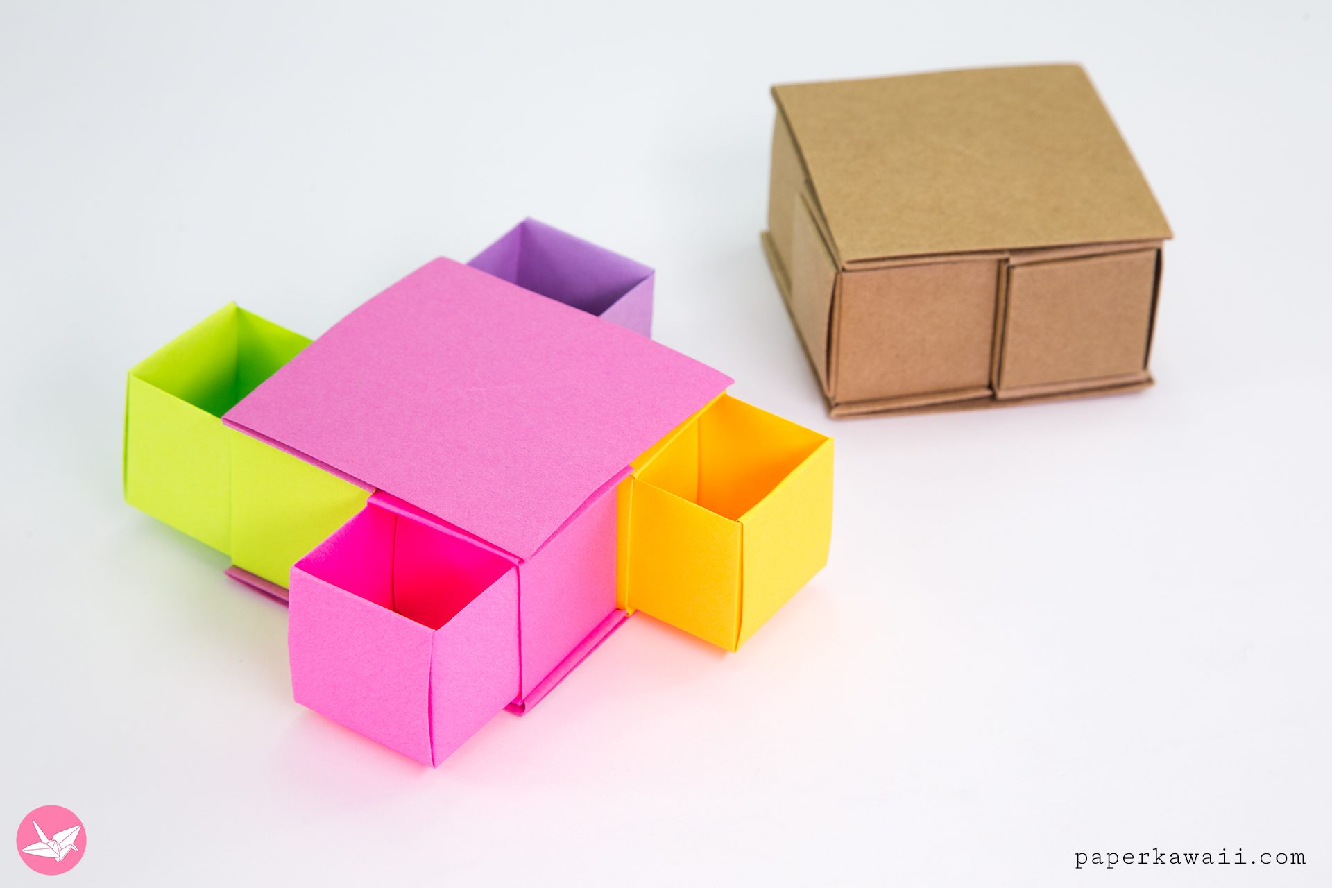 Learn how to make an origami secret drawer box using no cutting or glue, just paper. This origami drawer box has 4 inner boxes and is easy and fun to make!